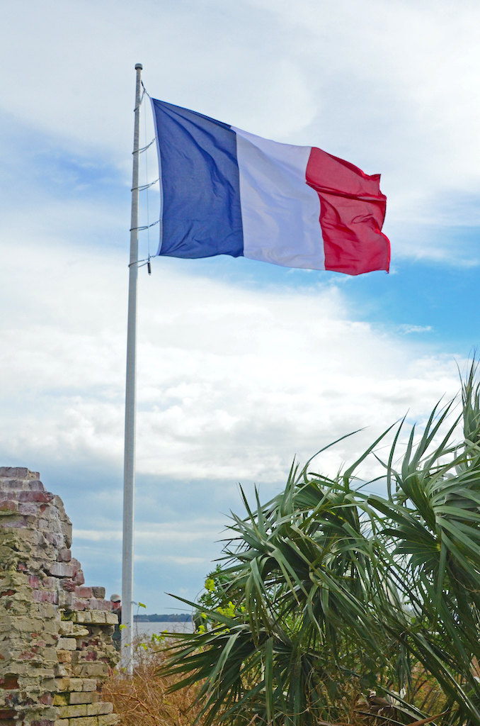 The French Tri-Color flag flying over Castle Pinckney in Charleston Harbor