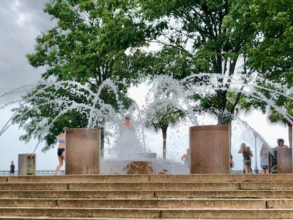 A boy in the fountain at Waterfront Park