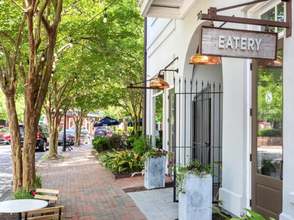 Shaded sidewalk and storefronts in I'On